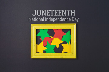 Juneteenth freedom day concept with colorful paper stars and frame on black background. Top view, flat lay
