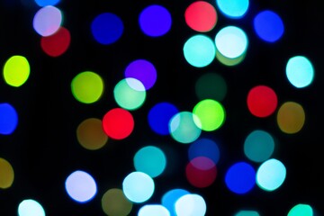 Round glitter bokeh sequin confetti on black background