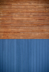 blue metal siding and wooden boards on the facade as a background 1