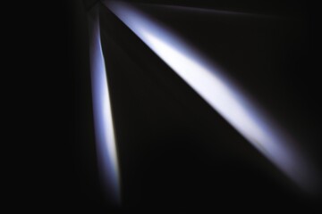 Neon lens flare white spotlight reflection on black background