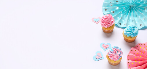 Delicious cupcakes with question marks and decorations on white background. Gender reveal party concept