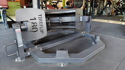 Tire flip machine at a gym, designed for enhancing strength and conditioning workouts.