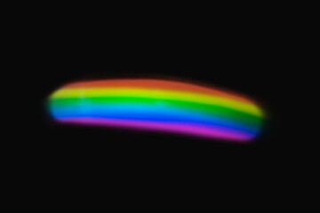 Neon lens flare prism rainbow light reflection on black background
