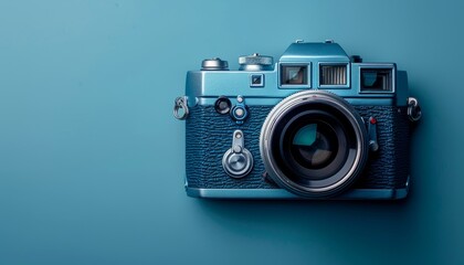 Vintage Blue Camera on a Matching Background.