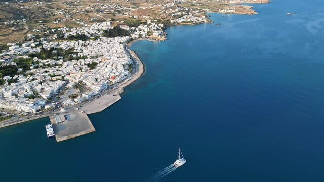 Aerial footage of the town and port of Parikia on the island of Paros, one of the many Cyclades Islands in the Aegean Sea.