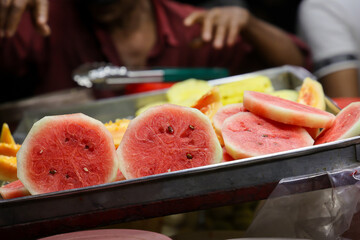 Watermelon fruit cut sliced in half Fruit shop in Calicut Kozhikode. Kiran a cold refreshing summer...