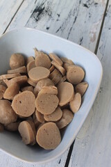 Sliced meatballs in a bowl on the table