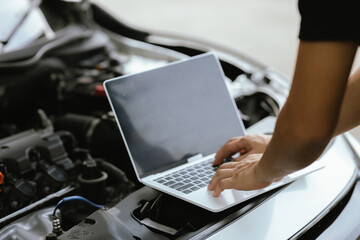 Modern mechanics use laptop computers to check engines. Gather detailed information during work....
