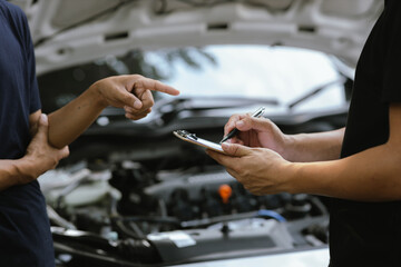 Mechanic checking engine Gather detailed information during work. Industrial plant maintenance services Until engine repair in factories, transportation, cars, vehicles