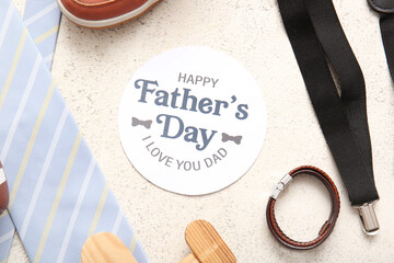 Paper with text HAPPY FATHER'S DAY, I LOVE YOU DAD and man's accessories on white background