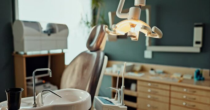 Empty, sink and dental room in clinic with dentistry equipment, appointment and medical office for treatment services or checkup. Furniture, workplace and hospital for oral health and hygiene.