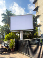 Ooh Billboard mockup outdoors. An empty outdoor at residential places for presentation. hoarding in...