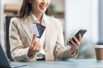 Proficient Asian businesswoman specializing in credit management. Skilled in navigating credit bureaus, analyzing APRs, managing balances, and optimizing credit card usage for financial goals.