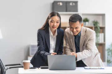 Collaboration between young Asian businesswoman and middle-aged businessman, achieving business success through dedication, effective efforts, and triumphant breakthroughs, milestones in careers.
