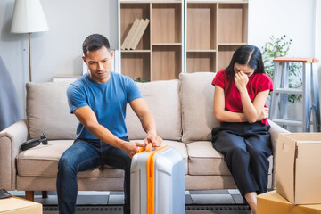 Young Asian couple managing a relocation amidst quarrels and disagreements. Proficient in handling...