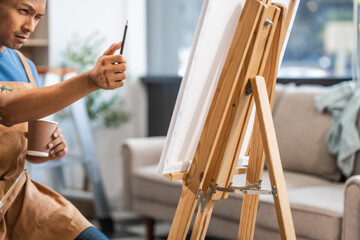 Middle-aged Asian man, skilled painting artist, donning an apron. Proficient in art, creativity,...