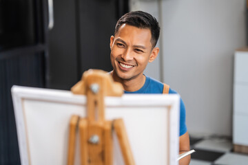 Middle-aged Asian man, skilled painting artist, donning an apron. Proficient in art, creativity,...