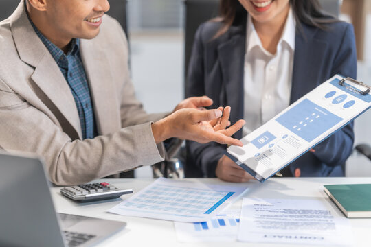 Asian businesswoman and businessman managing online consulting ventures. Expertise in investment consulting, delivering actionable plans, optimizing bandwidth, implementing feedback-driven strategies