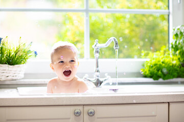 Little baby taking bath