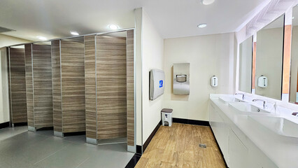 Row of public toilet modern design interior, Modern Public Restroom, lavatory, water closet and...