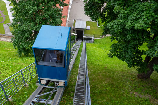 Blue funicular car on the tracks
