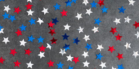 4th of July American Independence Day. Presidents Day. Red, blue and white star confetti,...