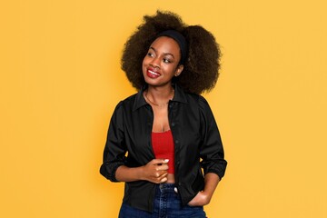 Beautiful black woman isolated on yellow background