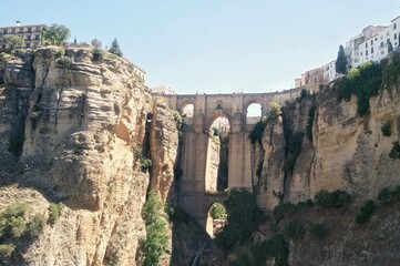 Puente Nuevo arch bridge over the tajo Gorge at Ronda village, Spain. Tourist viewpoint cliff in...