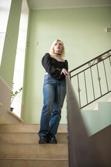 Studio portrait of a young beautiful blonde long-haired girl.