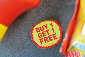 buy 1 get 1 free offer sticker and prodcuts on table 