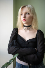 Studio portrait of a young beautiful blonde long-haired girl.