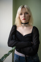 Fototapeta premium Studio portrait of a young beautiful blonde long-haired girl.