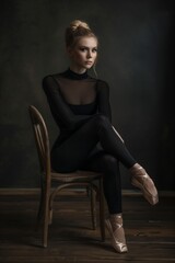 woman, sitting on chair in black tights and ballet shoes, dark room, dance studio