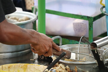 Fototapeta premium Various light snacks served fried in hot oil in a pan and served using typical Indonesian chili sauce