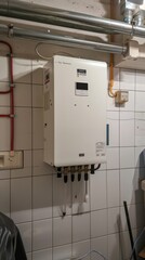 Modern external continuous flow gas water heater mounted on house wall