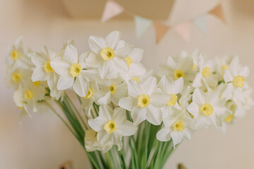 a vase of flowers with a baby shower on the table