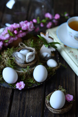 Mockup of white eggs on dark wooden background Easter still life