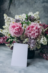 White card on spring bouquet backgraund, Card mockup, invitation mockup, postcard mockup