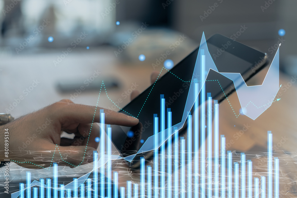 Poster close up of hand at office desk using tablet with creative growing forex chart on blurry background.