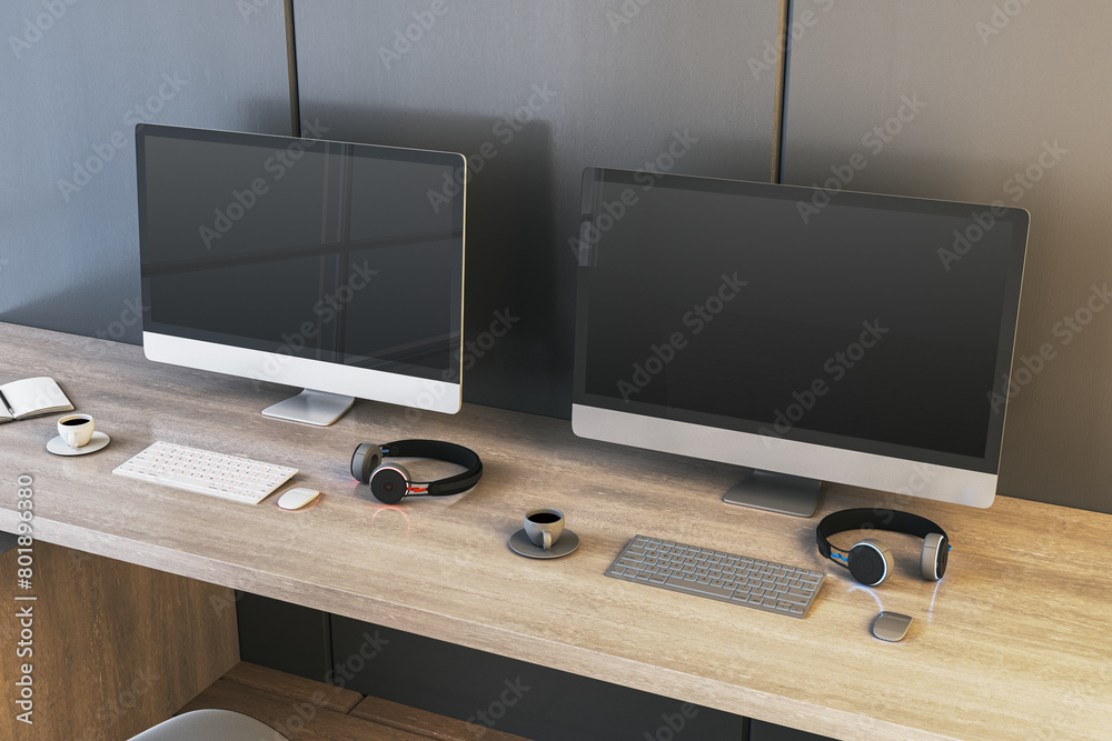 Aufkleber Two empty gaming computer displays on desk with coffee cups and headsets. Place for your advertisement. Gaming club concept. Mock up, 3D Rendering.