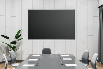 Modern meeting room interior with furniture and empty black mock up poster on wall. 3D Rendering.