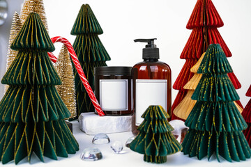 dark jar with lid and dispenser on the background of Christmas decorations, side view