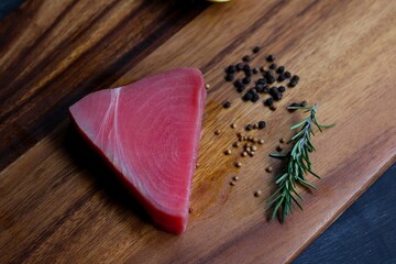 Tuna raw fish on wood plate 