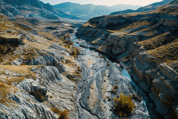 Obraz premium An aerial view of a dried-up riverbed after being washed away by the river, with a vast expanse of land.