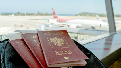 passports on suitcases at the airport before boarding the plane