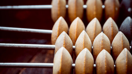 vintage abacus or abacus on wooden background