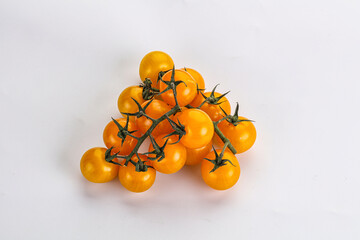 Ripe yellow cherry tomato branch