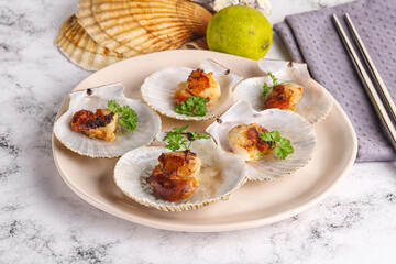 Grilled scallops shell with butter