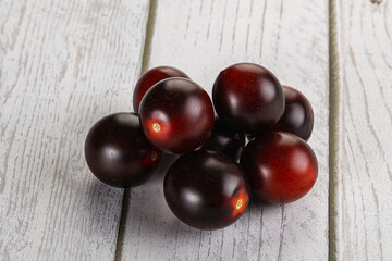 Raw ripe black kumato tomato