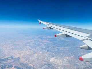 Fototapeta premium view from airplane window over Spain in Summer showing dry landscape